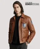 Action-shot-of-man-wearing-brown-Attack-on-Titan-Scout-Regiment-jacket-with-arms-raised-showing-embroidered-Wings-of-Freedom-on-both-sleeves-and-back.