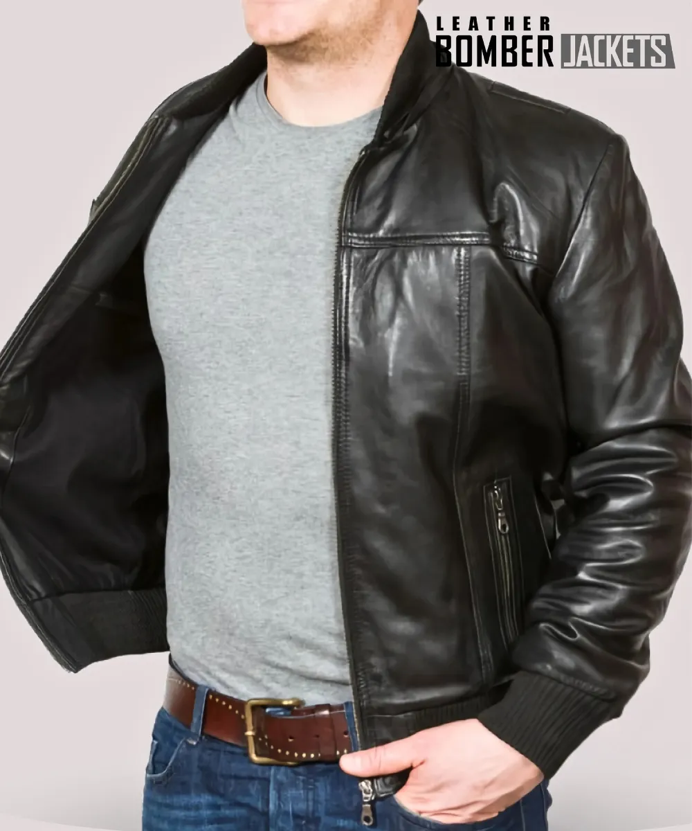 Rear-view-of-mens-hooded-black-leather-bomber-jacket-showing-adjustable-hood-and-ribbed-cuffs-perfect-for-rugged-fall-and-winter-layering